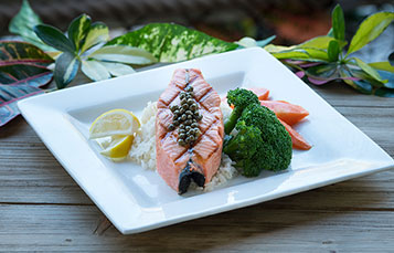 Enjoy salmon filet and other mouthwatering dishes at Sharks Underwater Grill at SeaWorld Orlando.